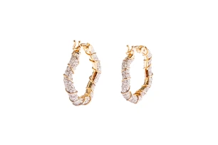 6 Top Jewelry Trends For 2024 6 jewelry trends for 2024 022124 0004 hoops yvonne leon twisted creoles earrings in 18 karat gold with grey diamonds