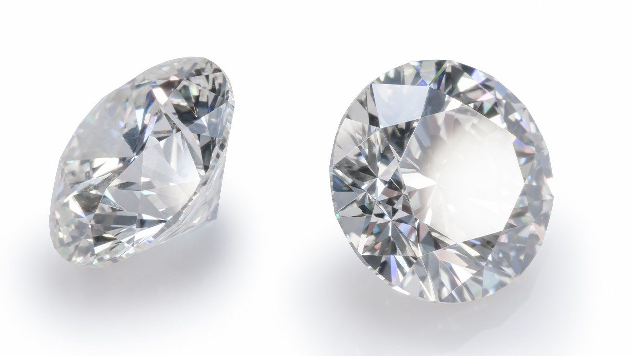 A pair of round polished diamonds. (De Beers)