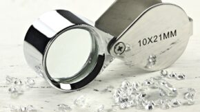 Polished diamonds and loupe credit Shutterstock 1280