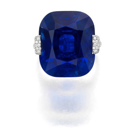 a blue ring with a diamond