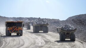 ACDC Burgundy Trucks hauling ore at Ekati mine 1280 USED 211223
