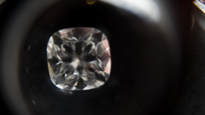 Loose Forevermark diamond seen through loupe credit Ben Perry slash Armoury Films slash De Beers 1280 USED 032724