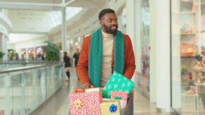 A man shopping for holiday gifts image (Shutterstock)