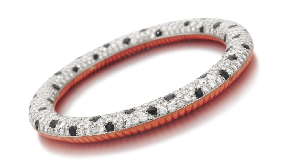 Onyx, coral and diamond diamond bangle bracelet, Sotheby’s image