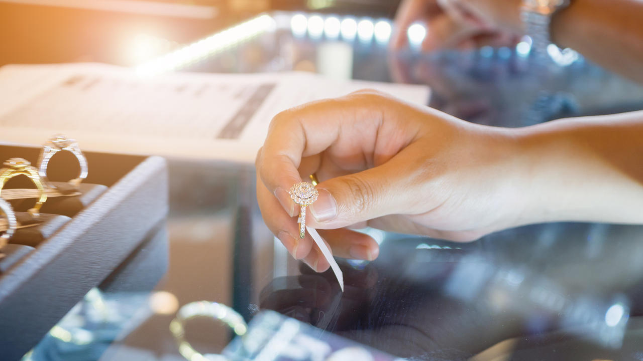 A woman buying jewelry image