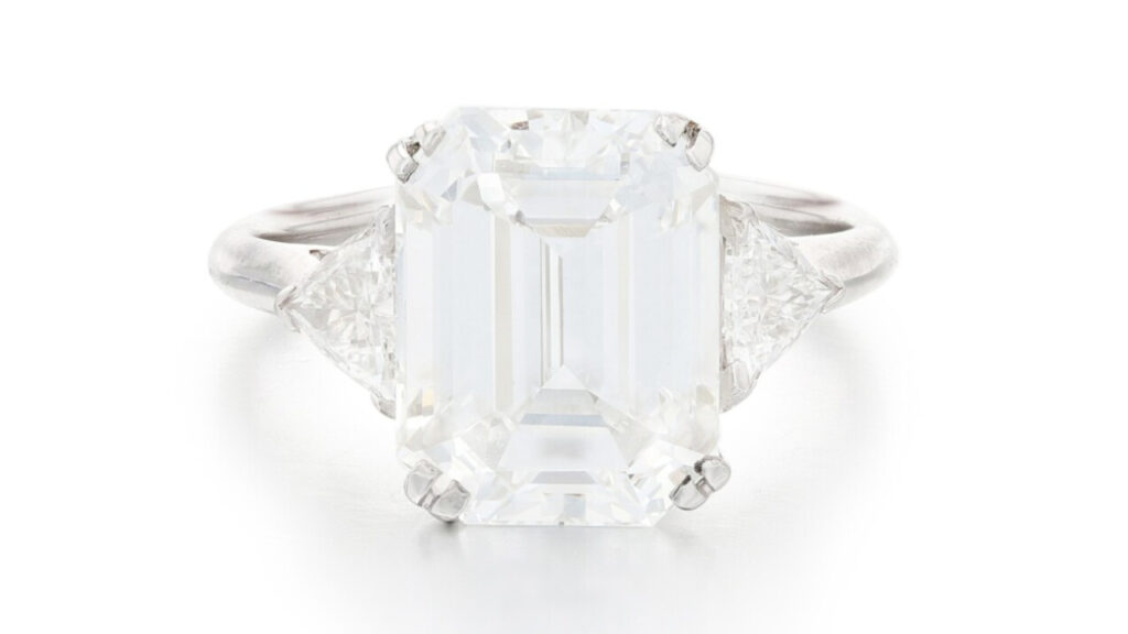 5.06-carat diamond flanked by triangular diamonds