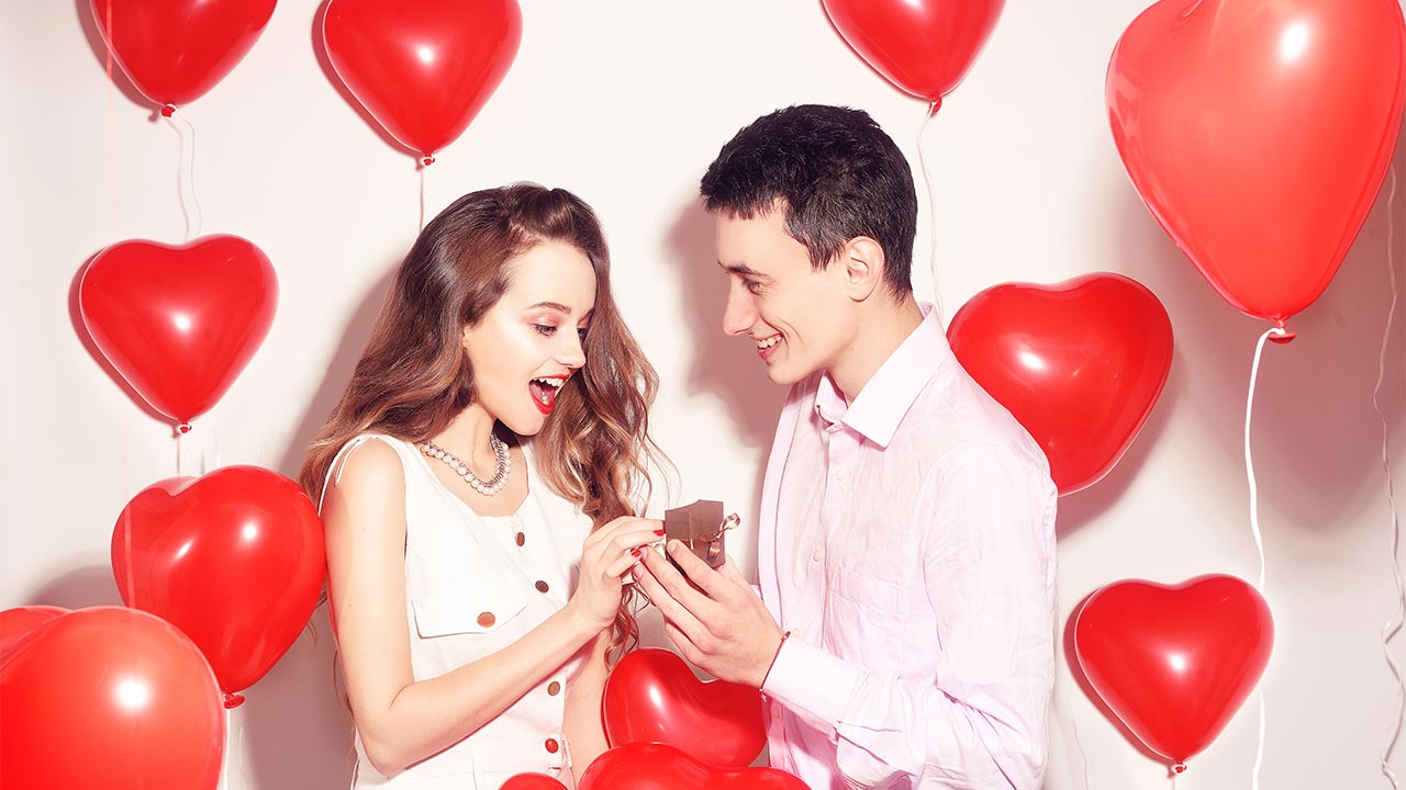 Man giving a woman jewelry on Valentine's Day image