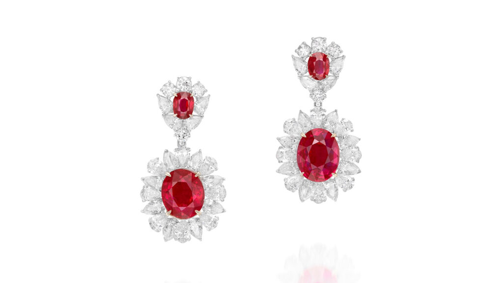 Pair of earrings featuring Burmese rubies within a surround of pear-shaped diamonds at Phillips image