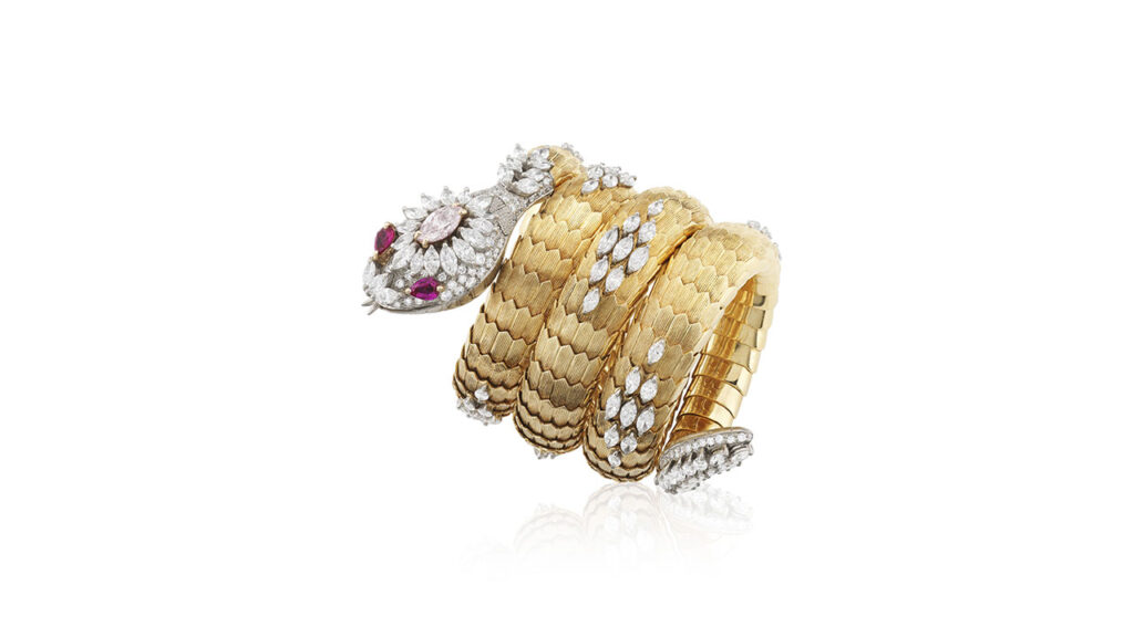 Serpenti wristwatch by Bulgari featuring rubies, diamonds and a light-pink diamond at Phillips image