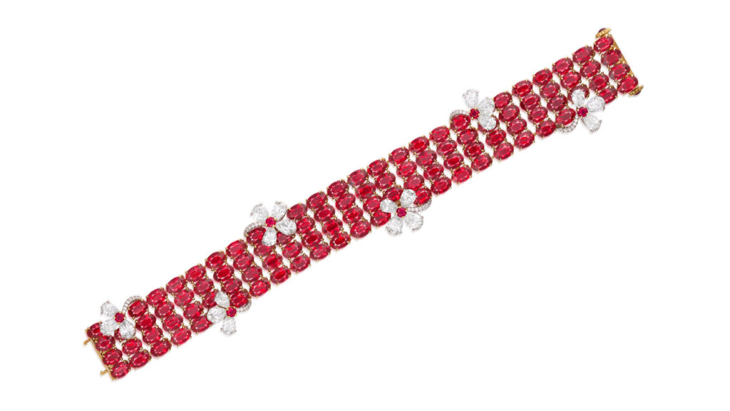 This ruby and diamond bracelet features four rows comprising 51.86 carats of oval Burmese rubies with circular rubies and pear-shaped and brilliant-cut diamonds forming floral motifs image