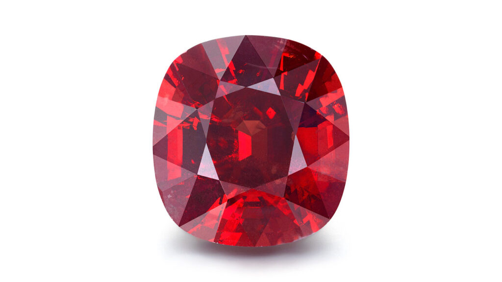 A ring bearing a cushion-shaped red Tanzanian spinel image