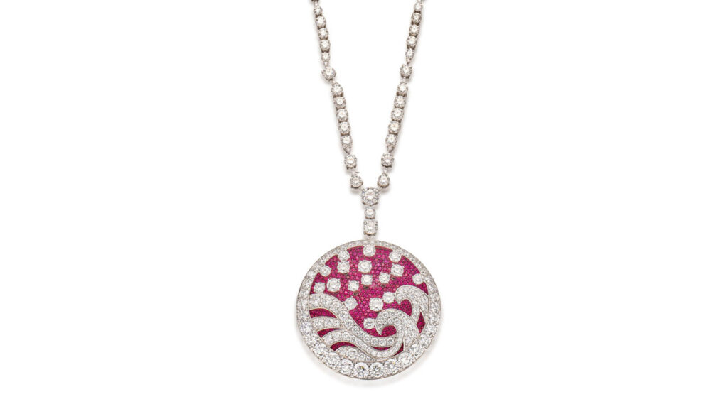 A Graff Wave necklace with a round pendant features a wave motif containing circular-cut rubies and brilliant-cut diamonds attached to a necklace with brilliant-cut diamonds set at intervals image