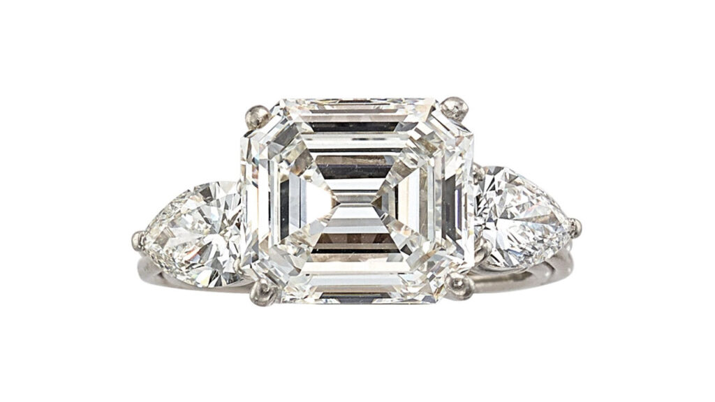 A ring, bearing an emerald-cut, 4.41-carat diamond between two pear-shaped diamonds at Heritage Auctions image