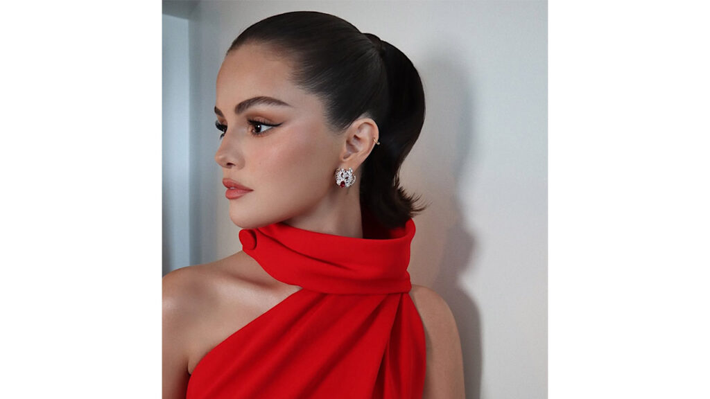 Selena Gomez matched her Tiffany and Co. jewelry with a red Louis Vuitton gown image