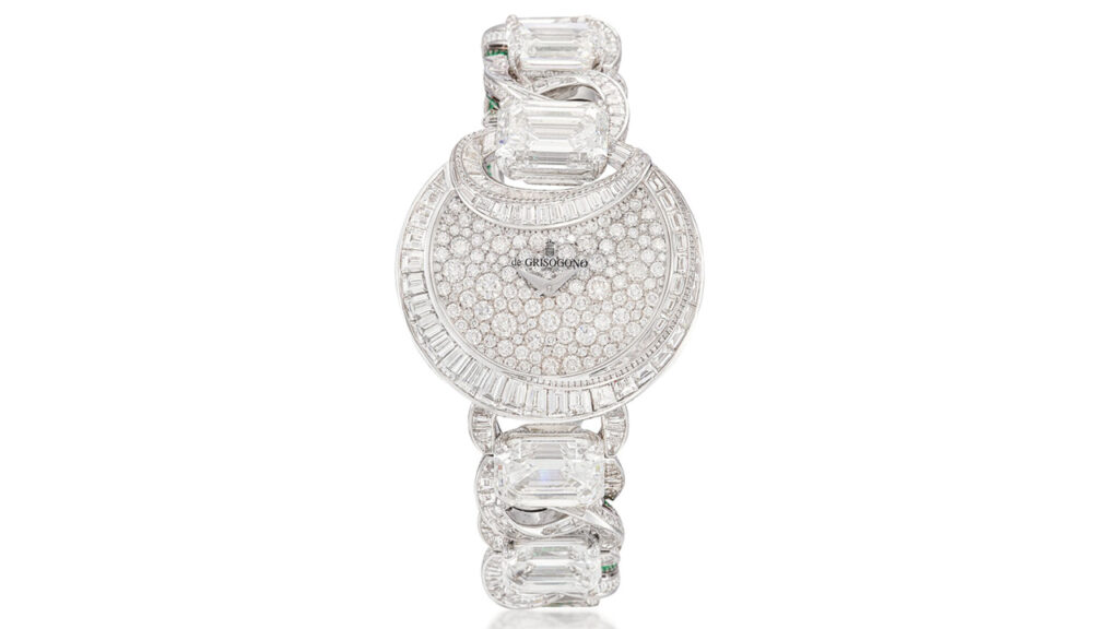 A de Grisogono Luna wristwatch has a half moon-shaped dial and bezel featuring brilliant-cut and baguette diamonds. The diamond-set, circular-link strap contains six principal step-cut diamonds, including a 7.10-carat one, as well as circular- and step-cut emeralds by Sotheby's image