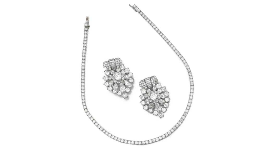 A Cartier set comprising a necklace with brilliant-cut diamonds and a pair of clip earrings with central brilliant-cut diamonds of 1.51 and 1.53 carats by Sotheby's image