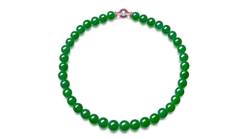 This necklace containing 39 translucent jadeite beads connected by a calibré-cut ruby, baguette and brilliant-cut diamond clasp at Sotheby's image