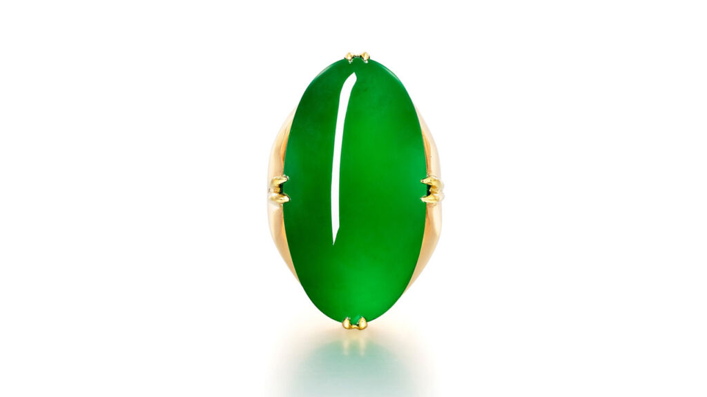 A ring containing an oval jadeite cabochon stone at Sotheby's image