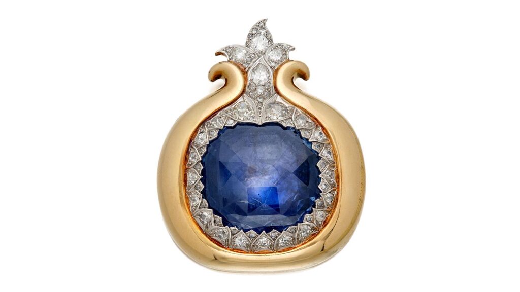 René Boivin Grenade brooch styled as a pomegranete, centering a sapphire, surrounded by pear-shaped diamonds at Sotheby's image