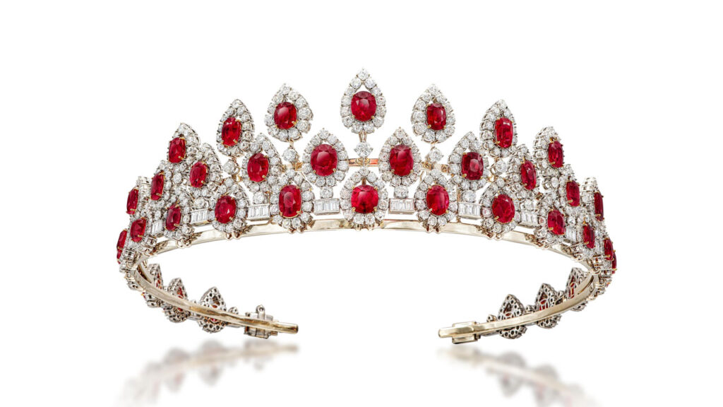 This piece is designed as a necklace that can convert to a tiara. It features a fringe of oval and cushion-cut Burmese rubies, surrounded by old European- and brilliant-cut diamond drops, all connected by trios of baguette diamonds at Sotheby's image