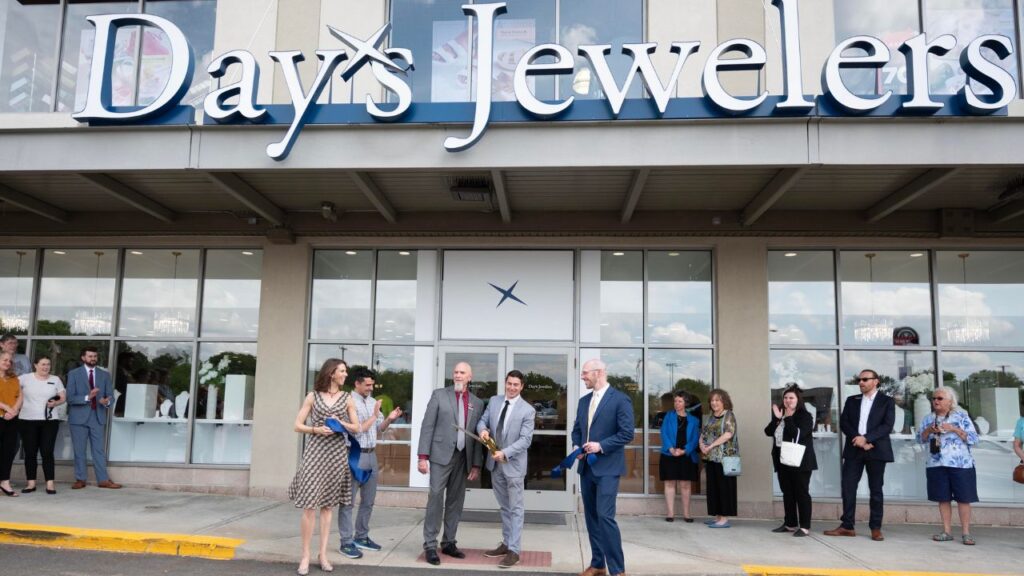 A ribbon-cutting ceremony outside the remodeled Day’s Jewelers branch in Manchester, New Hampshire image