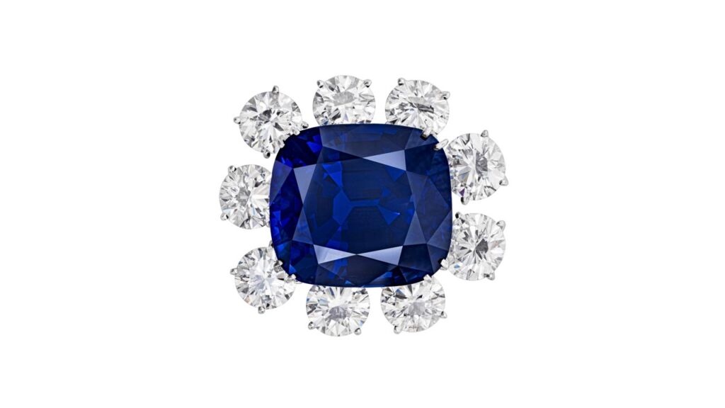 This brooch sports a cushion-shaped, 65.46-carat, royal-blue Burmese sapphire surrounded by nine round brilliant-cut diamonds weighing between 1.60 and 2.12 carats at Christie's image