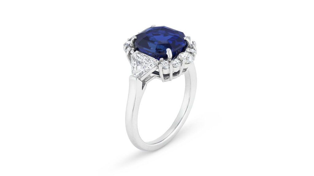 Ring with a modified octagonal step-cut, royal-blue Kashmir sapphire between triangular-diamond shoulders at Christie's image