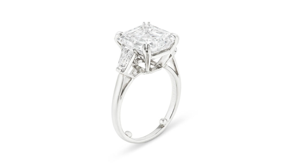 A Tiffany & Co. ring with a square emerald-cut, 7.05-carat, E, VS2 diamond and tapered baguette-cut stones at Christie's image