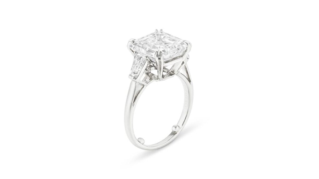 A Tiffany & Co. ring with a square emerald-cut, 7.05-carat, E, VS2 diamond and tapered baguette-cut stones at Christie's image