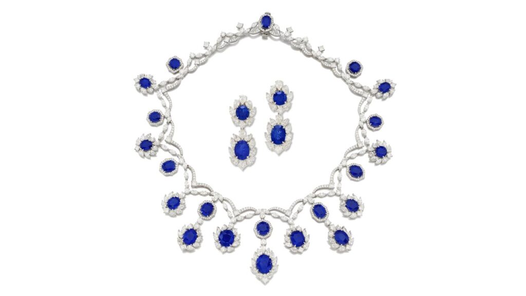This sapphire and diamond demi-parure comprises a necklace with cushion-shaped and oval Burmese sapphires, ranging from 1.96 to 10.08 carats, within a frame of pear, marquise, princess and brilliant diamonds, as well as a pair of pendant earrings with detachable surmounts at Sotheby's image