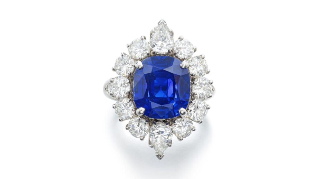 Van Cleef & Arpels ring features a cushion-shaped, 7.69-carat Kashmir sapphire within a border of pear-shaped and brilliant-cut diamonds at Sotheby's image
