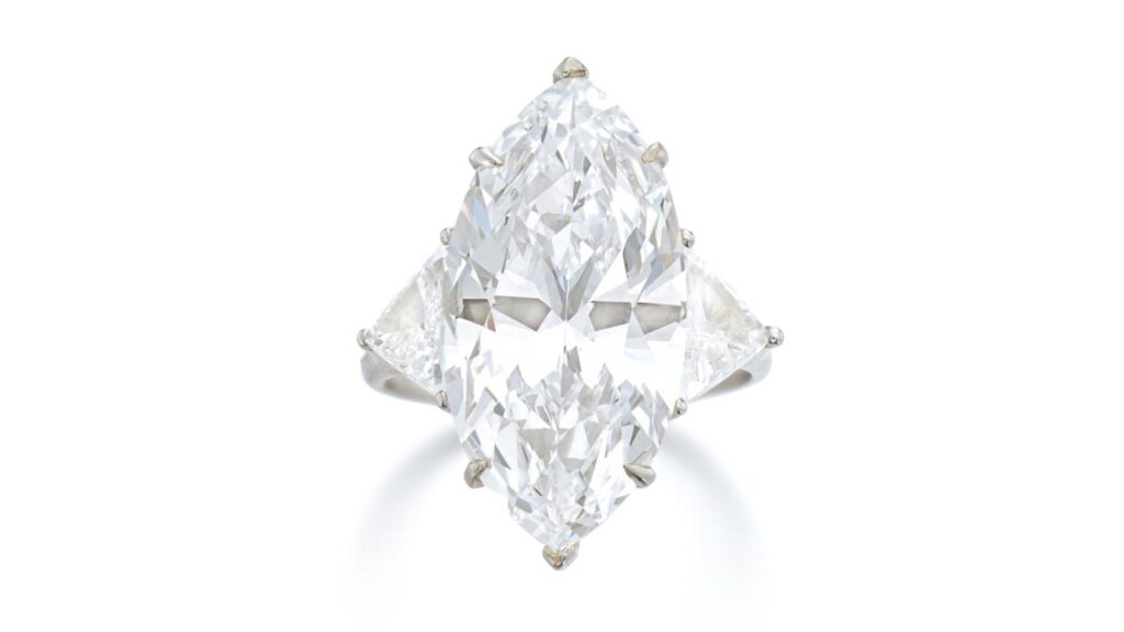 This Graff ring has a marquise-shaped, 10.04-carat, D-color, VVS2-clarity center stone between triangular diamond shoulders at Sotheby's image