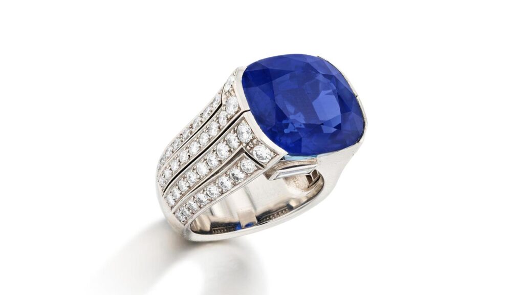 This ring from Cartier bears a cushion-shaped, 18.25-carat Burmese sapphire with brilliant-cut and baguette diamond shoulders at Sotheby's image