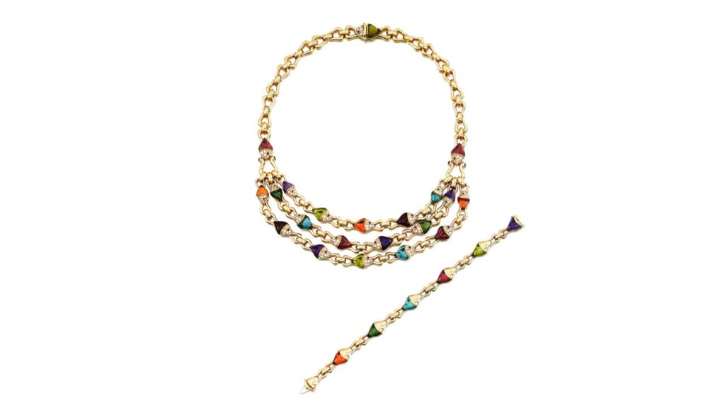 This Bulgari necklace and bracelet set features amethyst, tourmaline, citrine and blue topaz fish with brilliant-cut diamond heads and circular-cut rubies at Sotheby's image