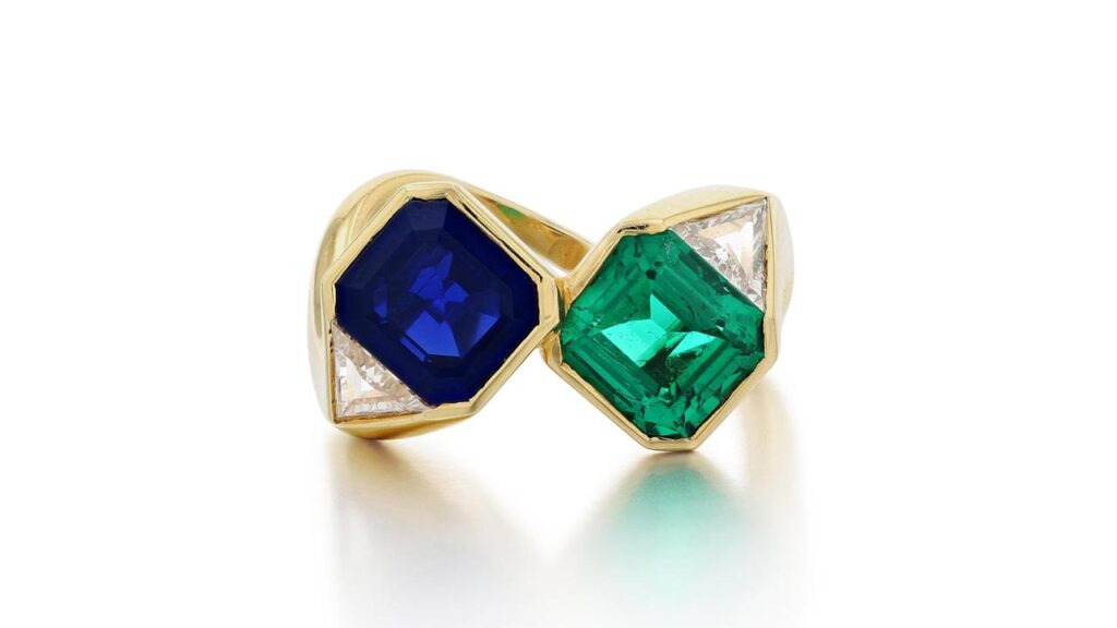 This toi et moi ring by Faraone sports a step-cut Colombian emerald, a Kashmir sapphire of the same cut, and triangular diamonds at Sotheby's image