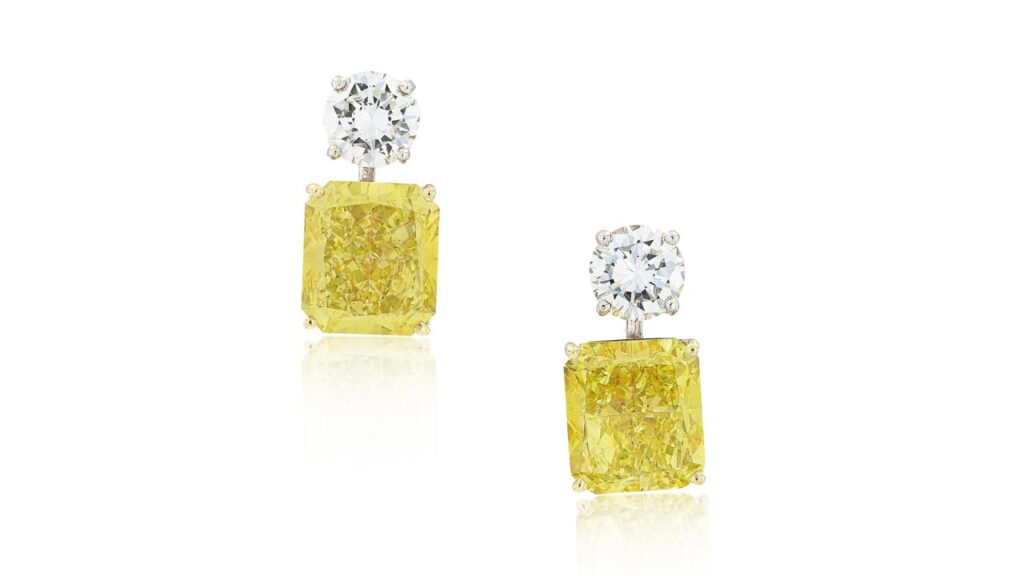 A pair of earrings by Graff, with radiant-cut, fancy-intense yellow diamonds weighing 6.53 and 7.04 carats as well as brilliant-cut diamonds at Sotheby's image