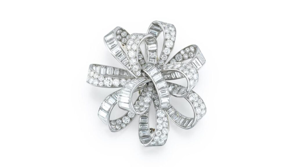 Diamond brooch designed as a bow ribbon by Van Cleef and Arpels at Sotheby's image
