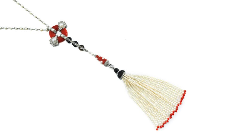 A pearl, onyx, coral and diamond necklace by Cartier at Sotheby's image