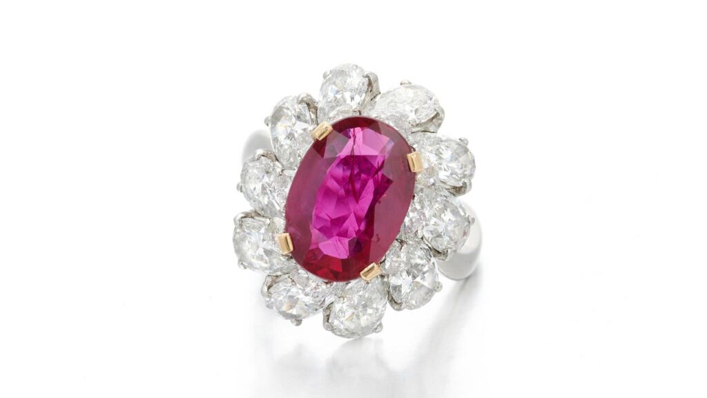 A Bulgari ring bears an oval-shaped Burmese ruby weighing 3.59 carats, in a pear-shaped diamond double frame at Sotheby's image