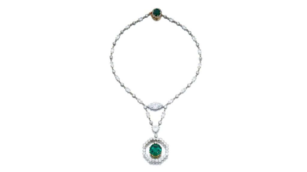Cartier created this necklace, which bears an octagonal step-cut Colombian emerald weighing 11.78 carats, surmounted by an old mine-cut diamond, swing-set within an old European-cut diamond frame. The necklace also contains a marquise-shaped diamond weighing 5.54 carats and a heart-shaped, 3.12-carat diamond, as well as a cushion-shaped, 2.64-carat emerald at Sotheby's image