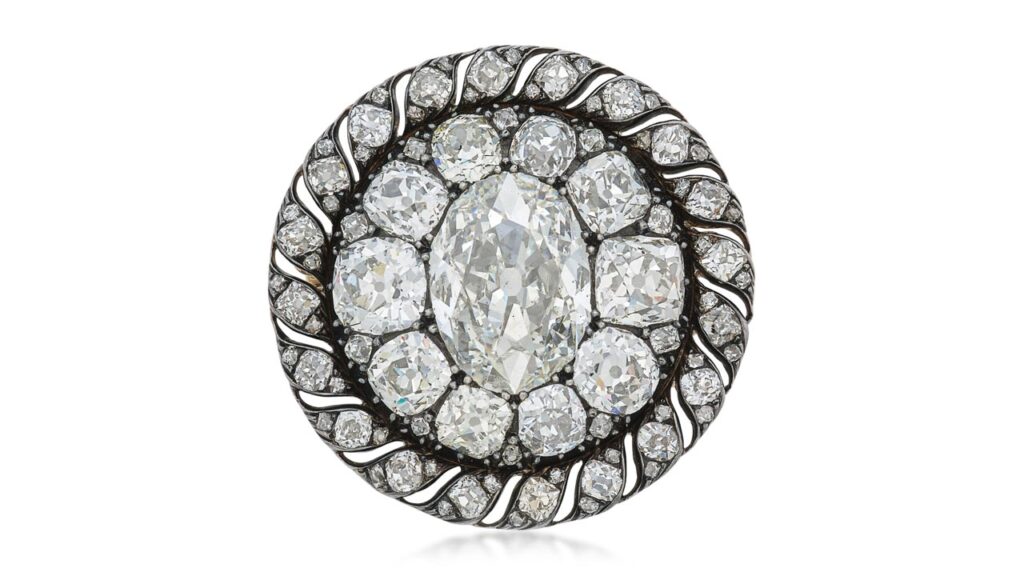 This brooch, which also functions as a pendant, has an oval diamond weighing 13.04 carats in an old mine- and mazarin-cut diamond surround at Sotheby's image