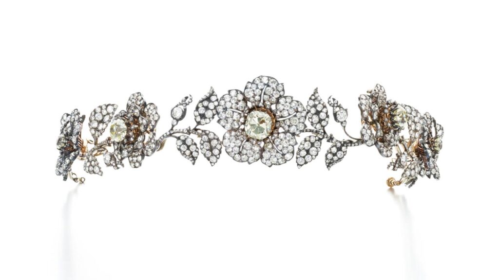 A diamond tiara designed as a garland of wild roses can be transformed into five brooches and two pairs of ear clips. Created around 1840. At Sotheby's image