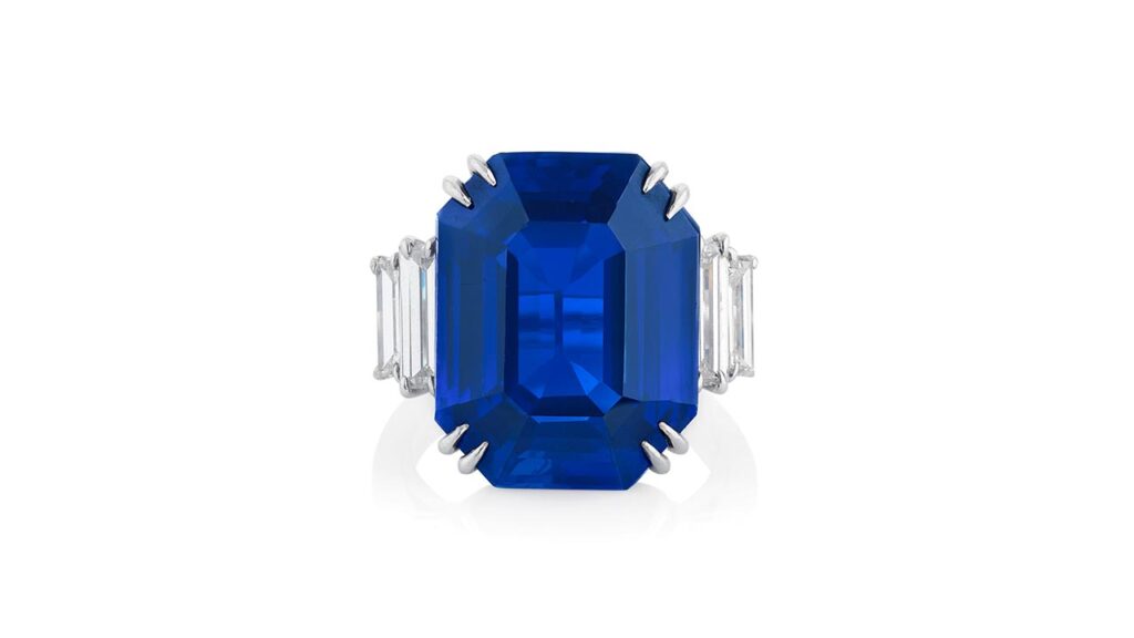 A ring bearing an octagonal step-cut, 18.09-carat Kashmir sapphire with diamond shoulders at Phillips image