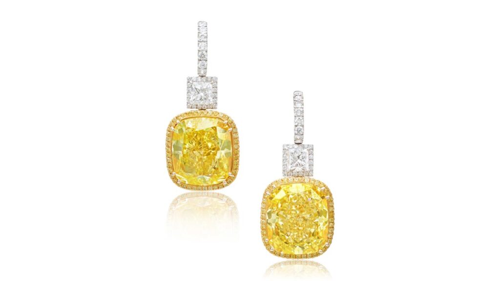 Scheiner designed these earrings sporting cushion modified brilliant-cut, fancy-vivid-yellow diamonds weighing 38.66 and 38.88 carats, suspended from rectangular modified brilliant-cut diamonds of 2 and 2.03 carats at Sotheby's image