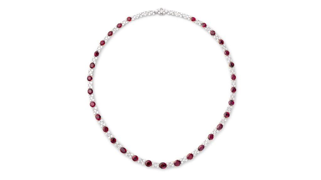 A necklace containing oval and circular-cut rubies, accented with brilliant- and princess-cut diamonds at Phillips image