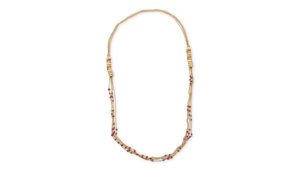 This Boucheron Frou Frou necklace features two textured gold-stack motifs, set with round diamonds and suspending four gold chains decorated with round faceted pink tourmaline beads and round diamonds at John Moran image