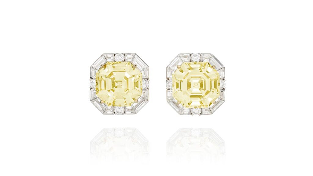 These Graff earrings with octagonal step-cut, fancy-yellow diamonds weighing 20.33 and 21.38 carats in baguette and brilliant-cut diamond surrounds at Phillips image