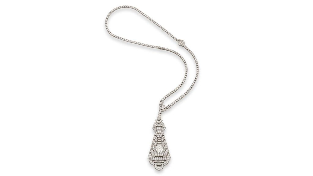 Van Cleef & Arpels designed this pendant in the 1920s. It sports a step-cut, 10.79-carat diamond and circular-cut and baguette diamonds at Phillips image