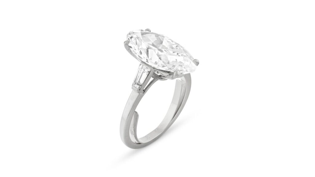 A ring with a modified marquise brilliant-cut, 8.73-carat, E-color, VVS2-clarity diamond between tapered baguette diamonds at Christie's image