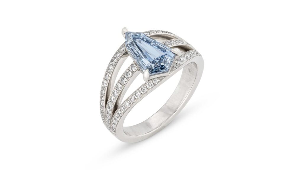 A kite step-cut, 1.66-carat, fancy-intense-blue, I1 diamond ring with round diamonds on the band at Christie's image